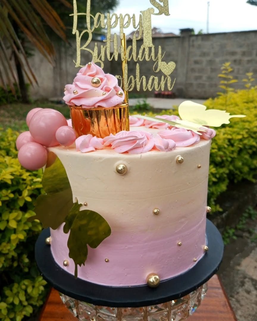 Blush pink birthday cake with cupcake topper and gold pearls by Mint and Cream Bake House