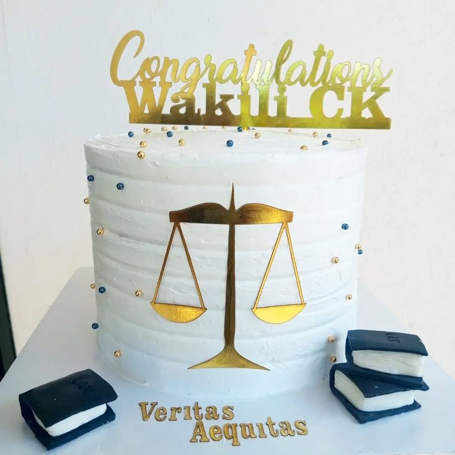 White cake with gold scales of justice topper, fondant law books — Congratulations Wakili CK